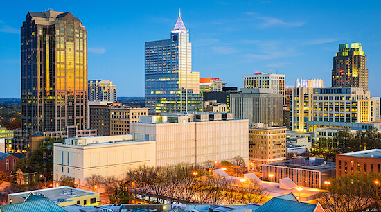 A view of the city skyline at dusk.